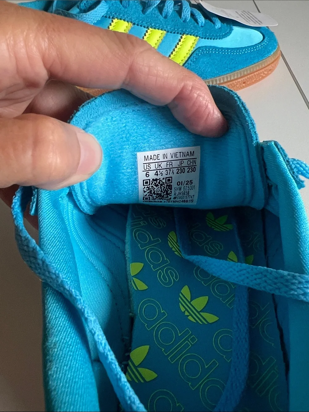 adidas Bright Turquoise Sneakers with Neon Yellow Stripes and Pink Accents